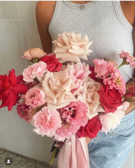 Person holding Valentine's Day Rose Bouquet 