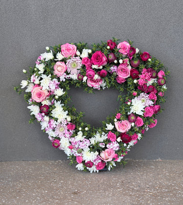 Heart shaped funeral wreath with fresh flowers